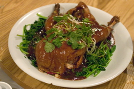 Duck braised in wine, with cilantro and spinach